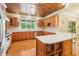 Spacious kitchen features stainless appliances, wood cabinets, and ample natural light at 150 Henderson Farm Dr, Woodstock, GA 30188