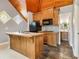 Kitchenette with island and sink, cabinets, microwave, and access to the bathroom at 150 Henderson Farm Dr, Woodstock, GA 30188