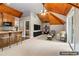 Spacious living area with wood-paneled ceiling, a kitchenette, and entertainment features, virtually staged at 150 Henderson Farm Dr, Woodstock, GA 30188