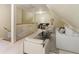 Attic living area featuring vaulted ceilings, and comfortable seating in a cozy setting at 150 Henderson Farm Dr, Woodstock, GA 30188