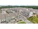 An aerial view of townhomes in a community with mature landscaping and sidewalks at 2501 Painted Buckeye Chase Se, Smyrna, GA 30080