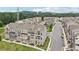 A peaceful street featuring townhomes and green trees provides a lovely neighborhood scene at 2501 Painted Buckeye Chase Se, Smyrna, GA 30080