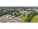 Aerial view of townhomes near pond, close to shopping and green spaces at 2501 Painted Buckeye Chase Se, Smyrna, GA 30080