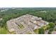 An aerial view of townhomes in a community with mature trees and lawns at 2501 Painted Buckeye Chase Se, Smyrna, GA 30080