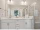 Modern bathroom featuring double vanity, large mirror, and a glass-enclosed shower at 2501 Painted Buckeye Chase Se, Smyrna, GA 30080