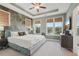 Stylish bedroom with a botanical accent wall, plush bed, and natural window shades at 2501 Painted Buckeye Chase Se, Smyrna, GA 30080