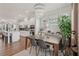 Bright dining area featuring modern chandelier, natural light and seamlessly flows into the open kitchen space at 2501 Painted Buckeye Chase Se, Smyrna, GA 30080