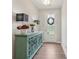 Inviting entryway with a decorative cabinet, hardwood flooring, and stylish lighting at 2501 Painted Buckeye Chase Se, Smyrna, GA 30080