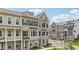 Attractive townhome with multiple windows, brick facade, black shutters and a well-manicured lawn at 2501 Painted Buckeye Chase Se, Smyrna, GA 30080