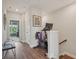 Bright hallway with a Peloton bike and natural light streaming from the green room at 2501 Painted Buckeye Chase Se, Smyrna, GA 30080