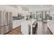 Well-appointed kitchen with stainless steel appliances, quartz countertops, and breakfast bar seating at 2501 Painted Buckeye Chase Se, Smyrna, GA 30080