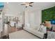 Bright living room with a white sofa, modern accents, and open layout to the kitchen at 2501 Painted Buckeye Chase Se, Smyrna, GA 30080