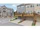Stylish townhomes featuring a back deck overlooking a two-car garage and lush landscaping at 2501 Painted Buckeye Chase Se, Smyrna, GA 30080