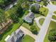 Aerial view of a home on a large lot with mature trees in a residential neighborhood at 1670 Burnt Oak Way, Dacula, GA 30019