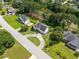 Aerial view of a lovely home in a manicured neighborhood featuring lush landscaping and mature trees at 1670 Burnt Oak Way, Dacula, GA 30019