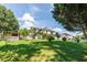 Expansive backyard featuring a lush lawn with mature landscaping, and a shed to the side of the property at 1670 Burnt Oak Way, Dacula, GA 30019