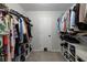 Spacious walk-in closet with ample shelving and hanging space for clothes and accessories at 1670 Burnt Oak Way, Dacula, GA 30019