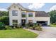 Charming two-story home with well-manicured lawn, a two car garage, and beautiful landscaping at 1670 Burnt Oak Way, Dacula, GA 30019