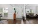 Bright foyer featuring hardwood flooring, a decorative rug, and large windows providing ample natural light at 1670 Burnt Oak Way, Dacula, GA 30019