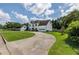 Picture perfect two-story home with an attached garage, green lawn, and beautiful landscaping at 1670 Burnt Oak Way, Dacula, GA 30019