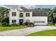Beautiful two-story home with a well-manicured lawn, fresh exterior paint, and attached two car garage at 1670 Burnt Oak Way, Dacula, GA 30019