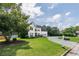 Charming two-story home with a lush green lawn, beautiful landscaping and a circular driveway at 1670 Burnt Oak Way, Dacula, GA 30019