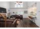Spacious living room with cathedral ceilings and a fireplace open to kitchen with breakfast bar at 1670 Burnt Oak Way, Dacula, GA 30019