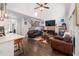 Inviting living room featuring hardwood floors, a fireplace, and comfortable seating at 1670 Burnt Oak Way, Dacula, GA 30019