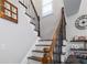 Staircase with hardwood treads, and decorative wall hangings at 1670 Burnt Oak Way, Dacula, GA 30019