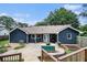 Backyard featuring a patio, grill station, deck with above ground pool, and dark siding at 50 Blackberry Lane, Covington, GA 30016