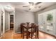 Cozy dining area featuring a ceiling fan and access to the outdoors through glass panel doors at 50 Blackberry Lane, Covington, GA 30016