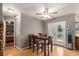 Dining area featuring a wooden table set, wood floors, and access to backyard deck at 50 Blackberry Lane, Covington, GA 30016