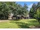 Well-kept single-Gathering home featuring a green lawn and a charming covered front porch at 50 Blackberry Lane, Covington, GA 30016