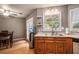 View of the sink area and dining area with stainless steel appliances and a double door in the kitchen at 50 Blackberry Lane, Covington, GA 30016