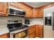 Kitchen showcases stainless steel appliances, wood cabinets, and stylish countertops at 50 Blackberry Lane, Covington, GA 30016