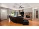 Spacious living room with beautiful wood floors and brick fireplace at 50 Blackberry Lane, Covington, GA 30016