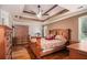 Spacious main bedroom boasts hardwood floors, a ceiling fan, and ample natural light at 50 Blackberry Lane, Covington, GA 30016