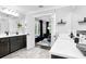 An elegant bathroom with modern fixtures, white countertops, and dark cabinetry at 510 Oak Dr, Hapeville, GA 30354