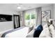 Modern bedroom with natural light, stylish mirror and comfortable bedding creating a serene retreat at 510 Oak Dr, Hapeville, GA 30354