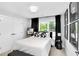 Inviting bedroom featuring a large window, closet, and unique artwork at 510 Oak Dr, Hapeville, GA 30354