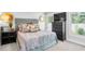 Comfortable bedroom featuring neutral colors, a large window, and accent pieces at 510 Oak Dr, Hapeville, GA 30354