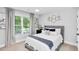 Stylish bedroom with window views, modern decor and a ceiling fan ensuring comfort and sophistication at 510 Oak Dr, Hapeville, GA 30354