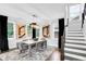 Bright dining room featuring modern chandelier, large windows, and decorative artwork at 510 Oak Dr, Hapeville, GA 30354