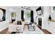 Comfortable living room features a white couch, fireplace, built-in cabinets, and hardwood floors at 510 Oak Dr, Hapeville, GA 30354