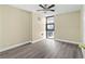 Spacious bedroom with hard surface floors, a ceiling fan, and natural light at 620 Peachtree Ne St # 911, Atlanta, GA 30308