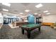 Spacious game room featuring a pool table, bar area, and comfortable seating at 620 Peachtree Ne St # 911, Atlanta, GA 30308