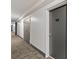 Long hallway with neutral carpet and doors showing unit number 911 at 620 Peachtree Ne St # 911, Atlanta, GA 30308
