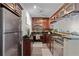 Kitchen featuring granite countertops, stainless steel appliances, and wine glass rack above peninsula at 620 Peachtree Ne St # 911, Atlanta, GA 30308
