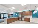 Kitchen area featuring a marble countertop, stainless steel appliances, and modern lighting at 620 Peachtree Ne St # 911, Atlanta, GA 30308