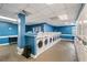 Clean laundry room featuring rows of washing machines and blue accents at 620 Peachtree Ne St # 911, Atlanta, GA 30308
